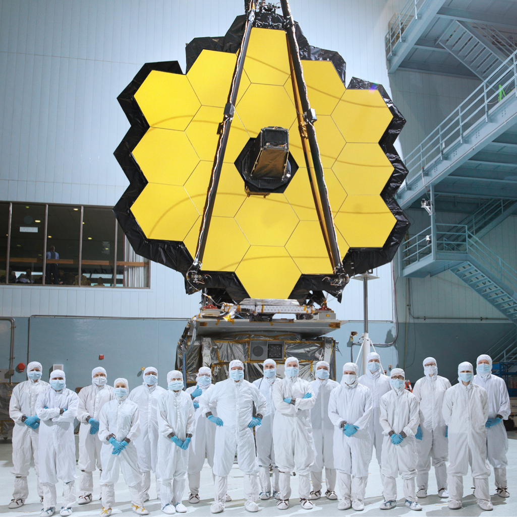 Team photo in front of JWST Optical Telescope Element